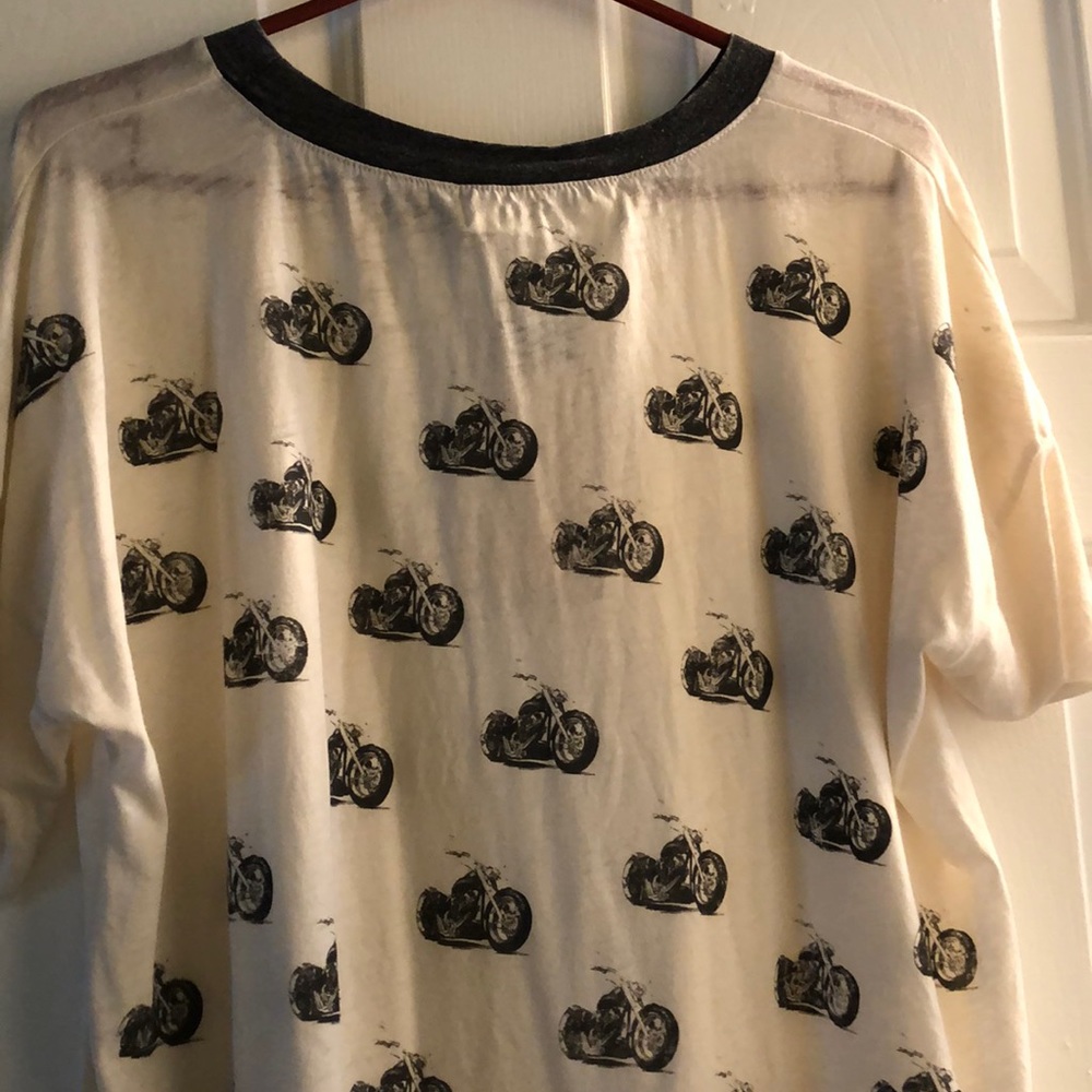Cream color T-shirt with motorcycles.